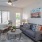 a living room with a couch and a table