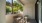 a patio with a table and chairs