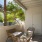 a patio with a table and chairs