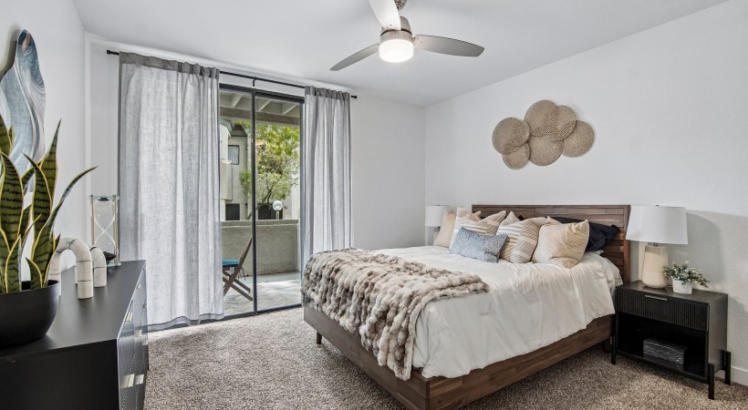 Bedroom with natural lighting and high ceilings