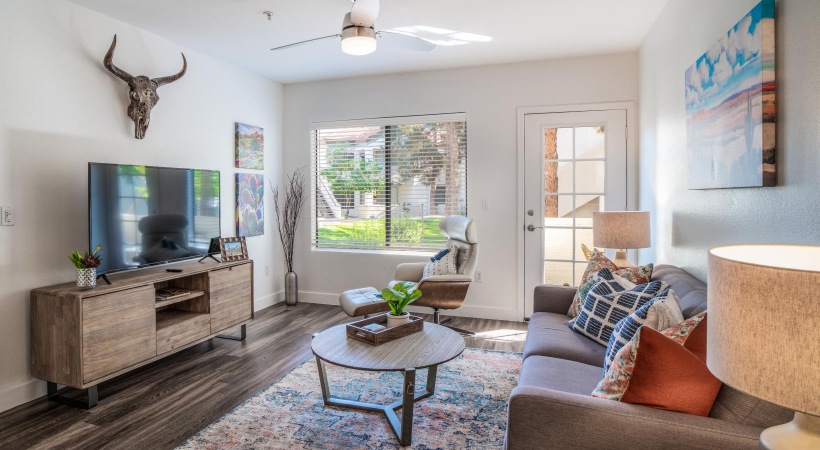 a living room with a tv and couches