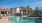 a swimming pool in front of a house