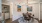 a dining room with a rug and a table