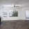 a room with a wood floor and a ceiling fan