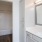 a bathroom with white cabinets
