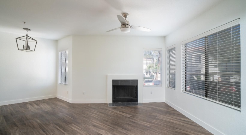 a room with a fireplace and a wood floor