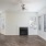 a room with a fireplace and a wood floor