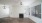 a room with a fireplace and a wood floor