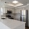 a kitchen with white cabinets
