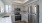 a kitchen with white cabinets