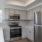 a kitchen with white cabinets