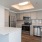 a kitchen with white cabinets