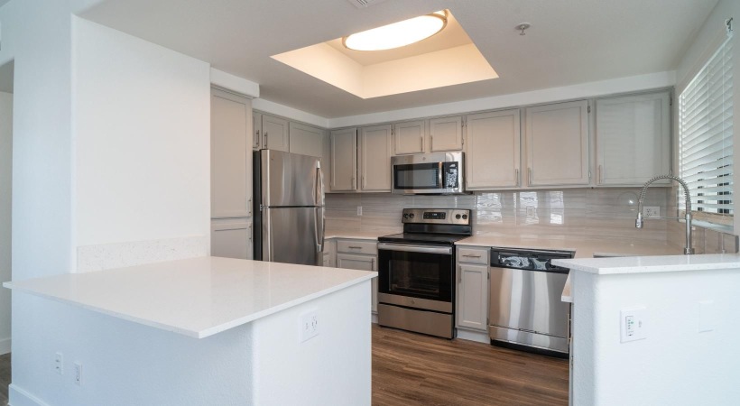 a kitchen with white cabinets
