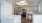 a kitchen with white cabinets