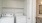 a white kitchen with a washer and dryer