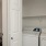 a kitchen with white cabinets